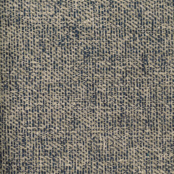 Woven fabric sample, beige and dark blue twill, irregular nubby texture with mottled pattern, white label reading “turri > fabric cat. x > 753 e”.